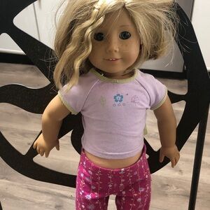 American Girl Doll with Blonde Hair and Purple Outfit